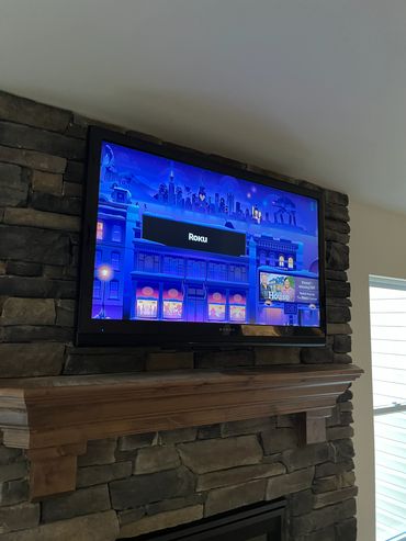 47" TV mounted in stone