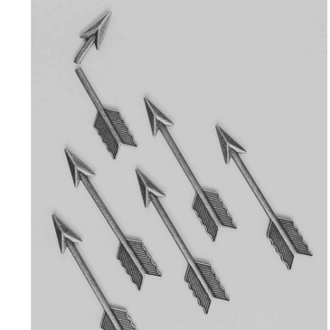 Six metal arrows pointing upwards on a gray surface. Represent ADHD