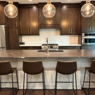 Modern kitchen with brown cabinets and island seating.
