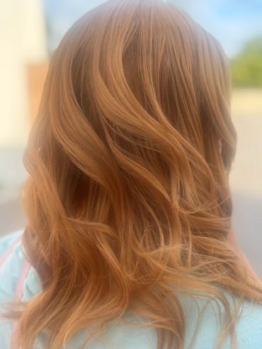 Wavy, light brown hair from the back.
