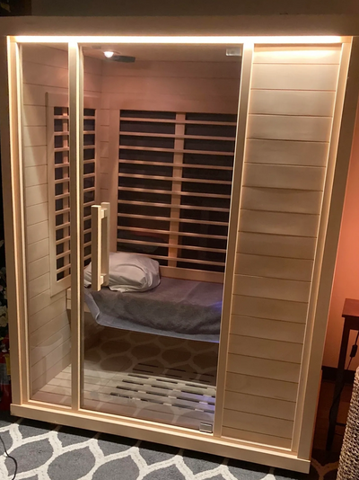 Far infrared sauna available for use, featuring a warm and inviting wooden interior for relaxation.