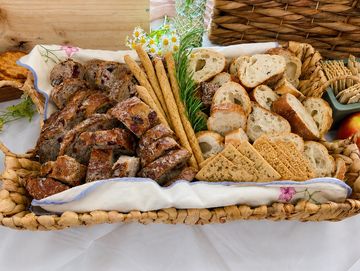 Basket filled with assorted breads and crackers.