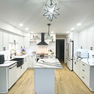 kitchen remodel quartz countertops granite cabinets kitchen island bright lights backsplash