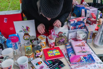 A member of the committee running a fundraising raffle. 