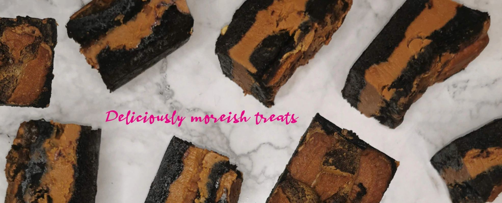Biscoff brownies displayed with a thick layer of Biscoff spread. Postal brownies Postal blondies.