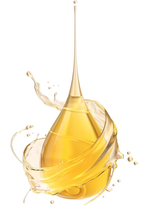 Golden oil drop surrounded by a swirling splash on white.