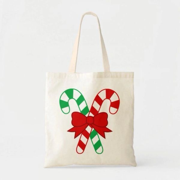 Tote bag with candy cane design and red bow.