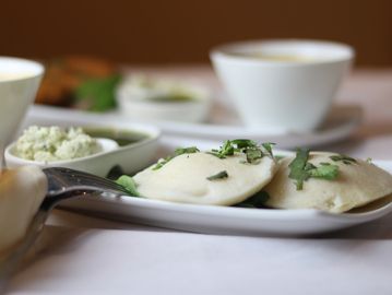 Dumplings with herbs and side dishes