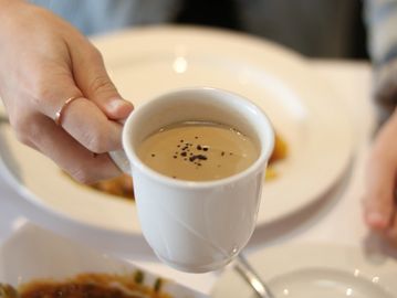 A man holding a cup of tea