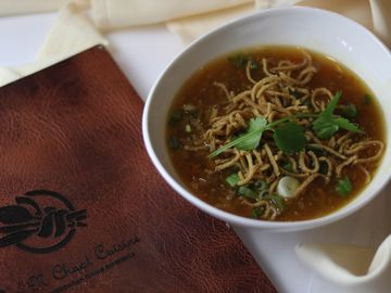 A Veg Manchow Soup in a bowl