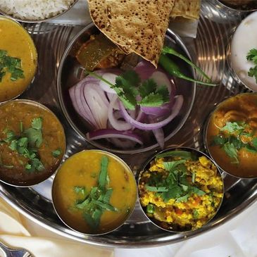 A tray of Indian curries and sauces