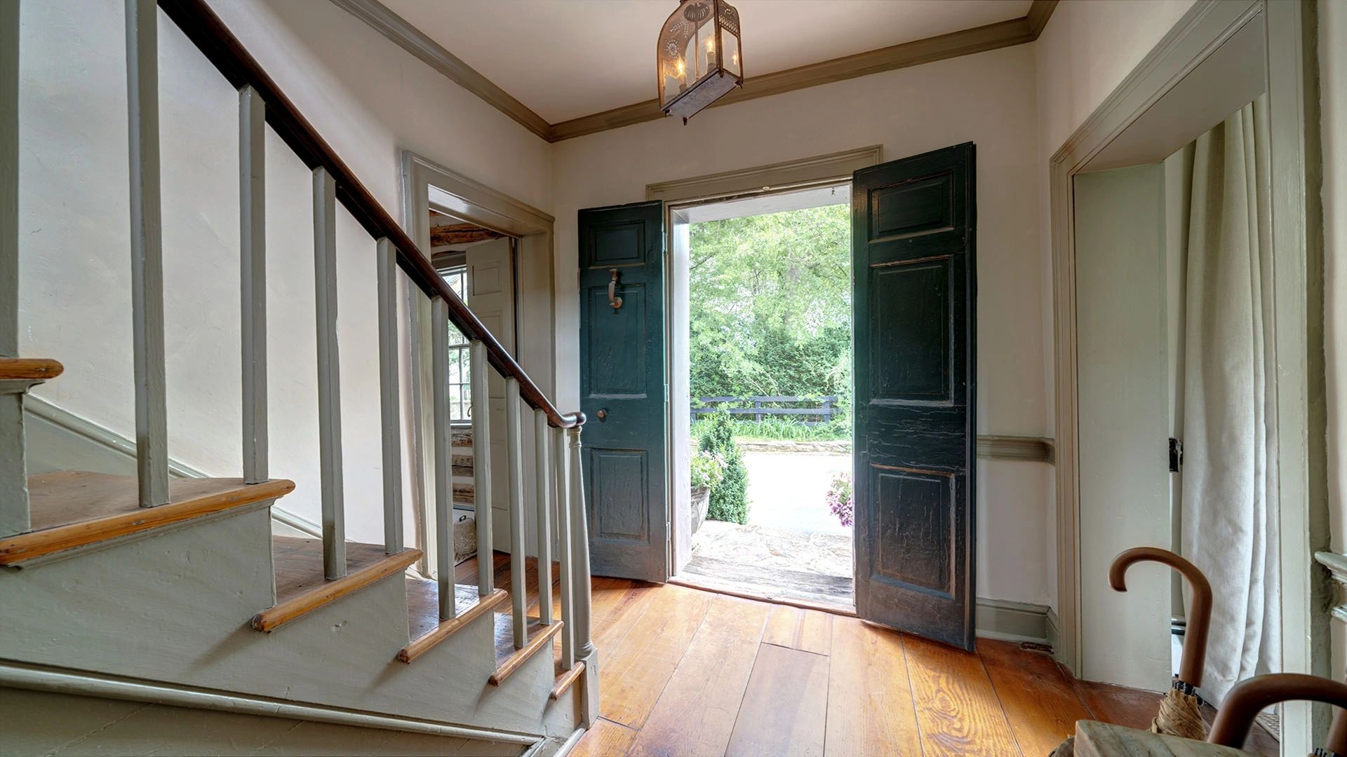 Front entrance with staircase to master bedroom, master bath and office.