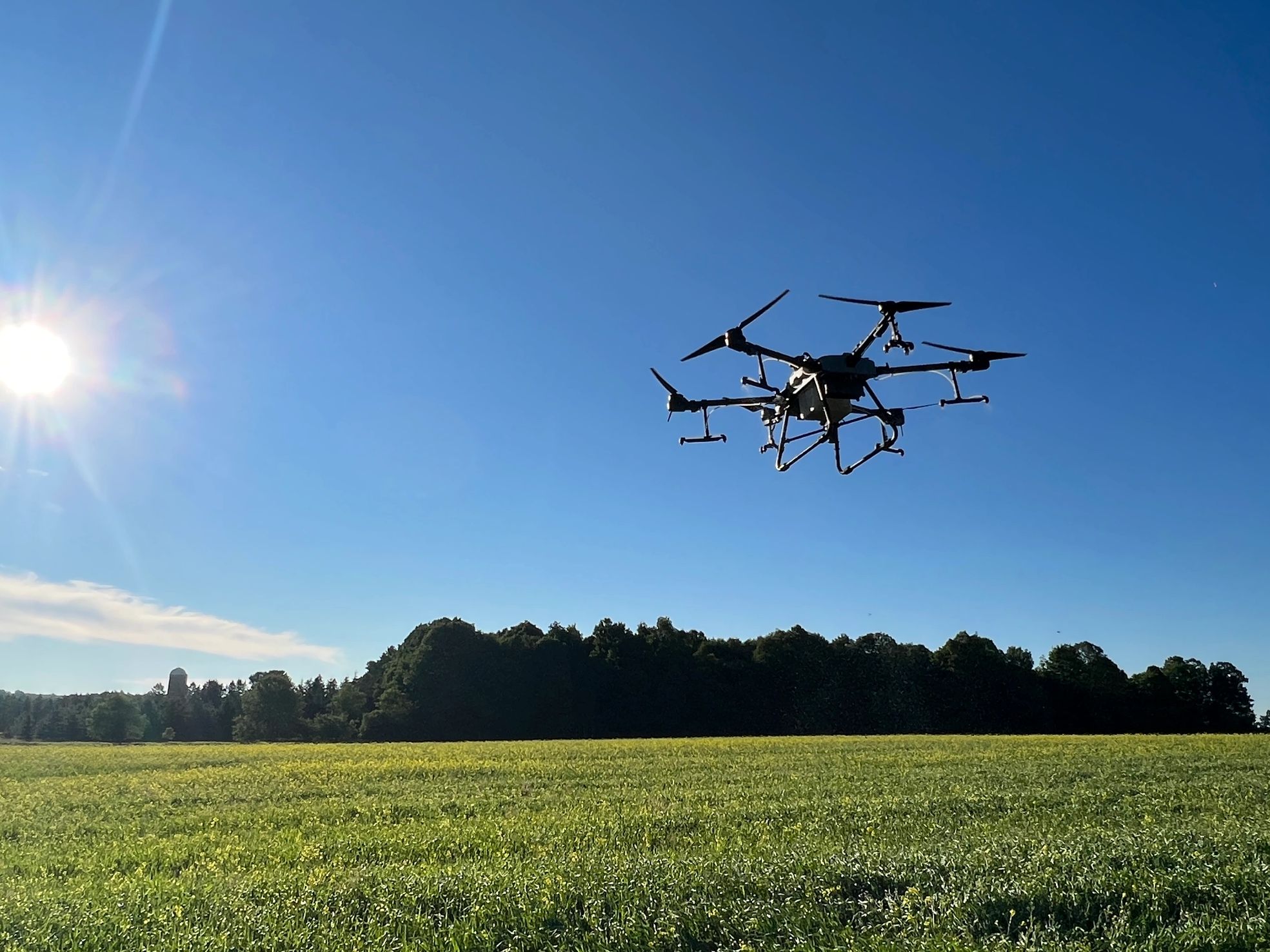 Agricultural drone flying over a field.