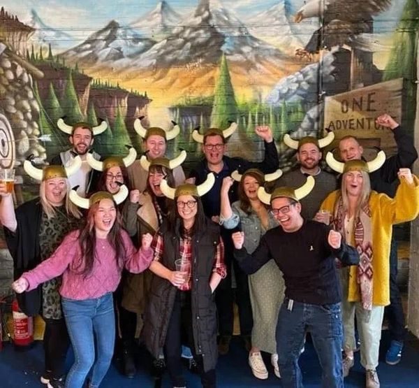 group of people wearing viking hats