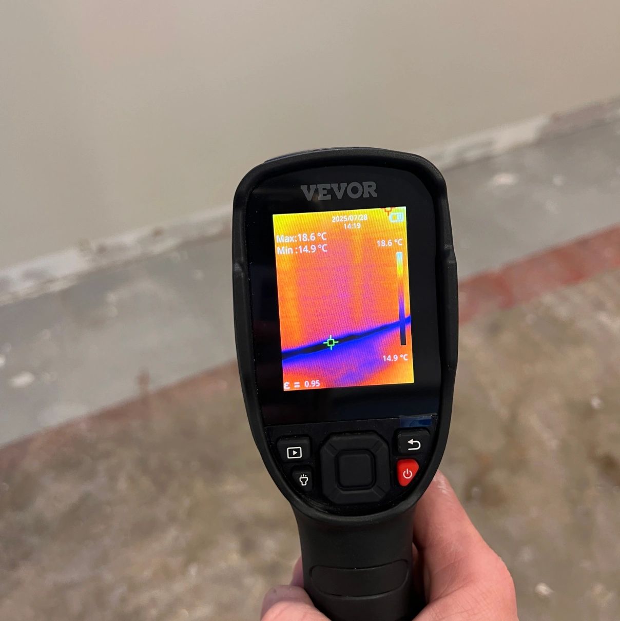 Thermal imaging camera detecting moisture and temperature differences on wall. Thermal imaging camera detecting moisture and temperature differences on wall.