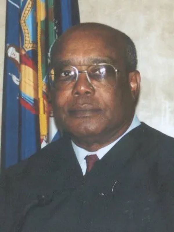 Portrait of a man in judicial robes.