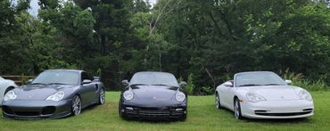 several different Porsche 911 models and colors