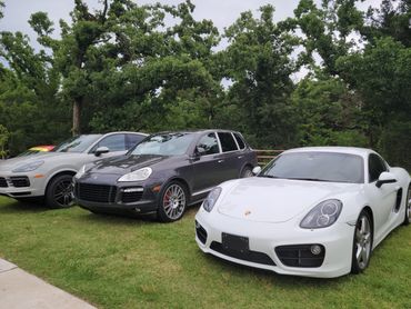 row of different Porsches