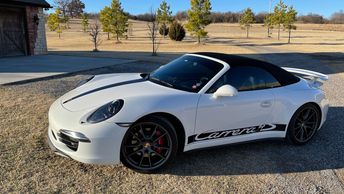 2013 White Porsche 911 Carrera 4S Cabriolet with top closed