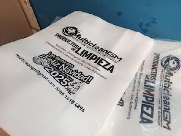 Plastic bags promoting cleaning products with Christmas greetings for 2025.