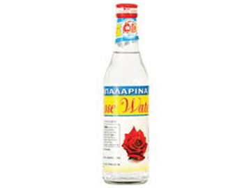Bottle of rose water with a red rose on the label.