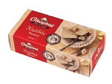 Box of Greek traditional halva dessert with sesame and nuts.