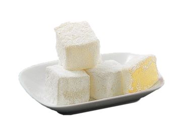 Powdered sugar-coated marshmallows on a white plate.