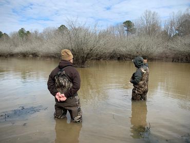 Canvas Biologist and Client assessing a slough to create a waterfowl habitat management plan