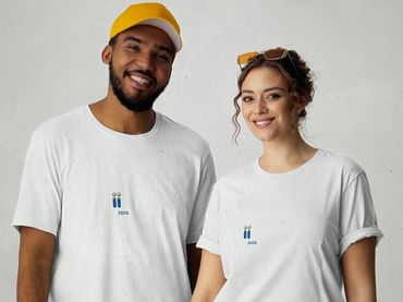 Smiling young man and woman wearing white t-shirts and a yellow cap.