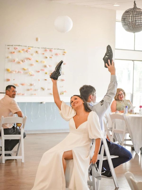 Couple smiling during wedding reception.