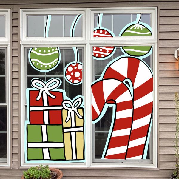 Festive Christmas window decorations with candy canes and presents.