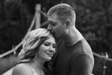 Couple sharing a tender moment outdoors.