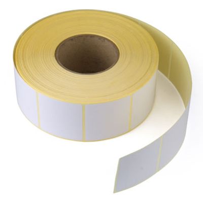 Roll of adhesive white labels with yellow backing.