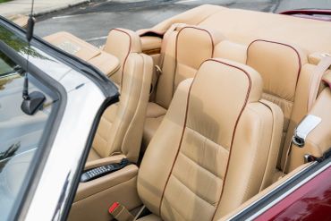 Beige leather car seats in a convertible.