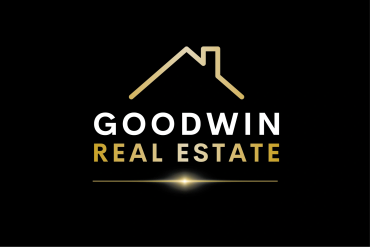 Gold and white Goodwin Real Estate logo with house outline.