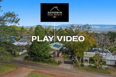 Scenic real estate property with Goodwin Real Estate branding.