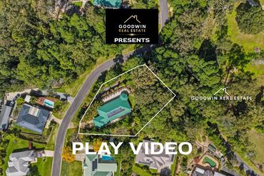 Aerial view of a property with a pool outlined for sale.