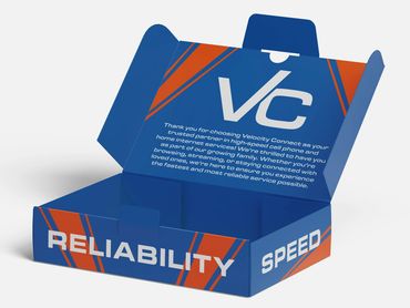A short folding carton that is open to show a welcome package for a telecom company.