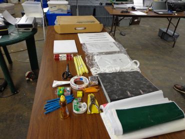 Disaster preparedness supplies laid out on a table.