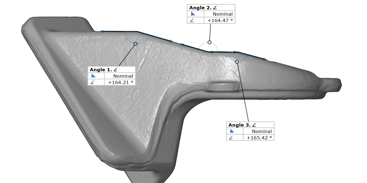 3D scanner and laptop showing scanned object.