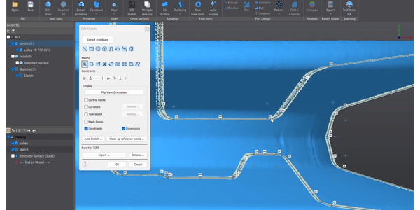 3D scanner and laptop showing scanned object.