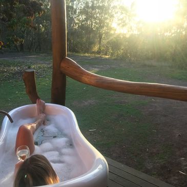 Relax, escape & unwind in the luxurious deep claw foot bath overlooking the 100 year old Mango Tree