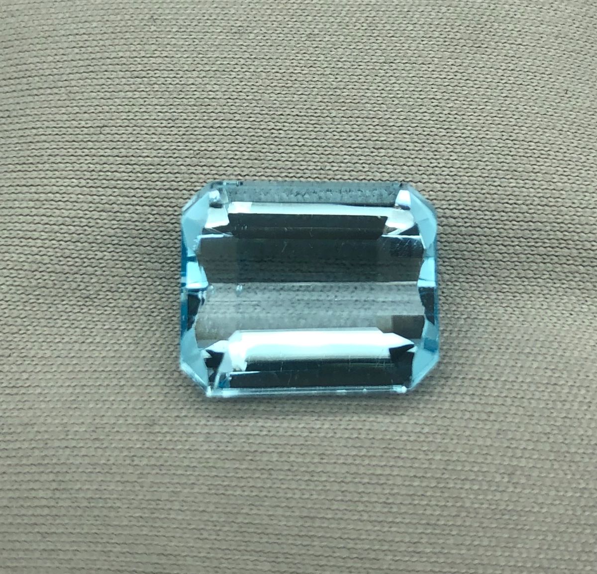 Natural Blue Topaz, 9.58 Carat Emerald Cut Faceted Gemstone.