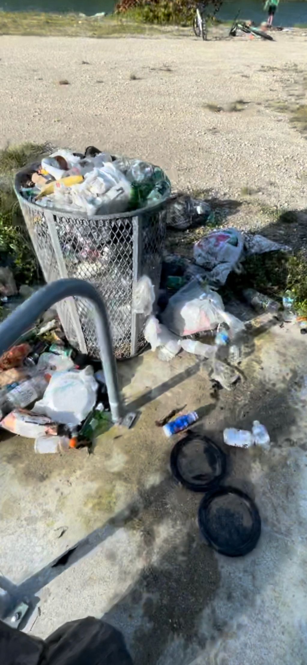 Trash scattered on the grounds from neglected garbage cans at Biscayne National Park FL USA 