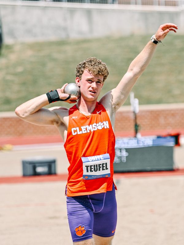 Alex Teufel holding shot put