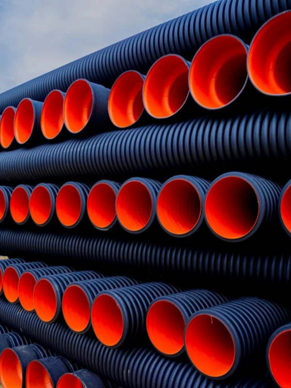 Stacked black and orange pipes.