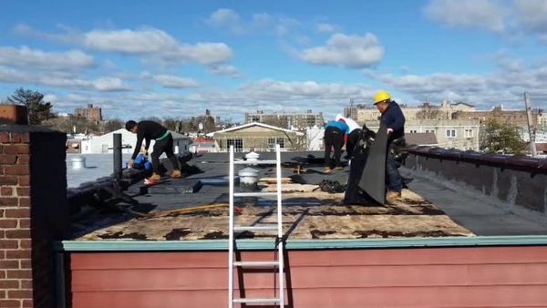 People working on roof