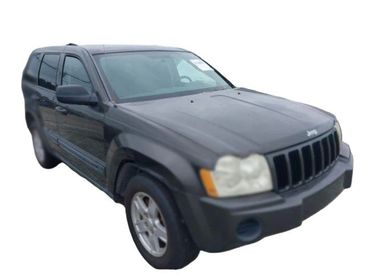 Black Jeep SUV parked with a slight front angle view.
