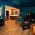 Sexy teal blue living room, rich velvet curtains, leather furniture, modern lighting