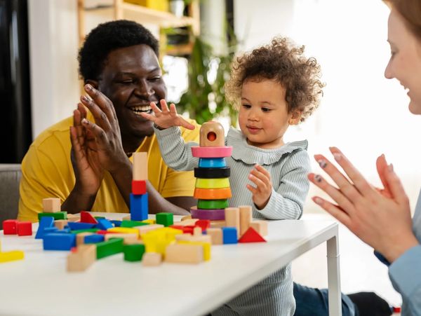 Dad and baby playing with blocks